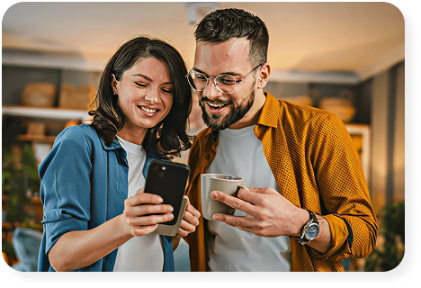 Couple looking at phone - Progress Credit